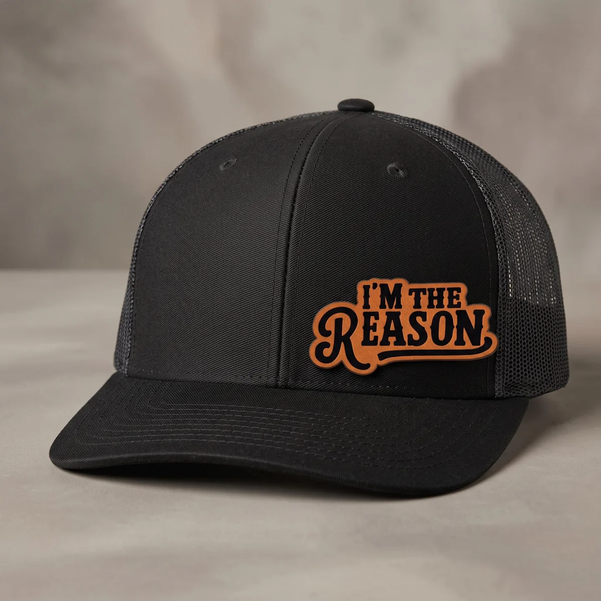 View 4 of I'm The Reason Leather Patch Trucker Hat